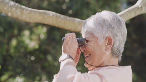 binoculars, hiking and freedom with a senior woman