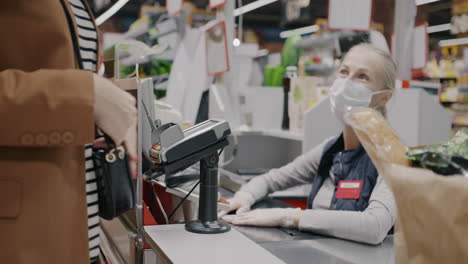 grocery store checkout with customers