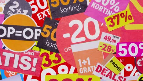 stop motion collage of sale stickers and percent signs, consumerism theme
