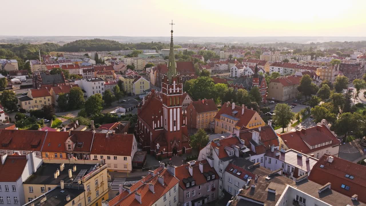 Cinematic travel aerial orbit around Gothic St Catherine Church, Ketrzyn Poland