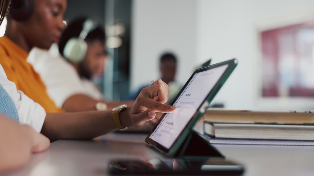 Close-up of a Person's Hand Interacting with a Digital Tablet