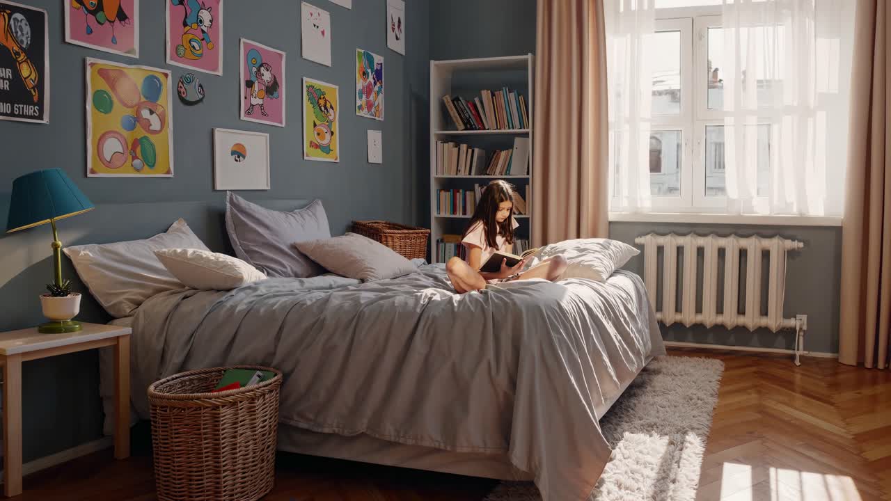 A close-up video captures a thoughtful young girl in a cozy bedroom, with soft lighting and framed