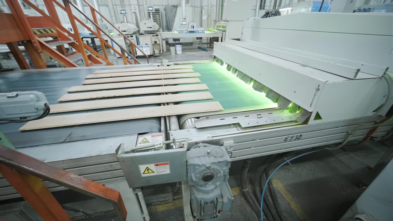 Wooden Planks Moving on Conveyor Belt in Industrial Factory