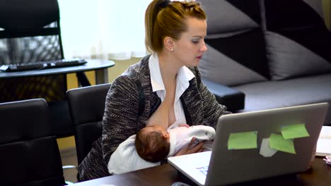 mother breastfeeding her baby at work