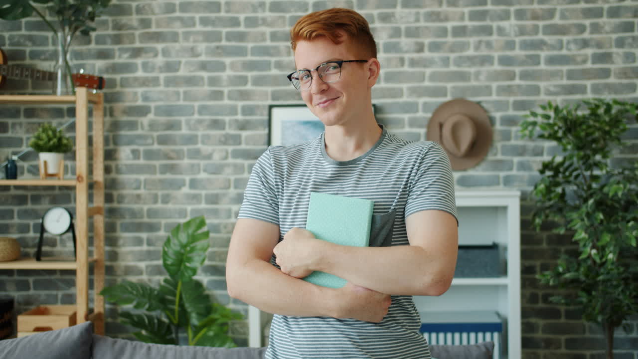 Young Man Holding a Book