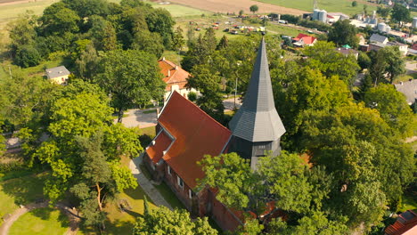 Drone-shot-of-beautiful-medieval-church-in-Trutnowy,-Poland