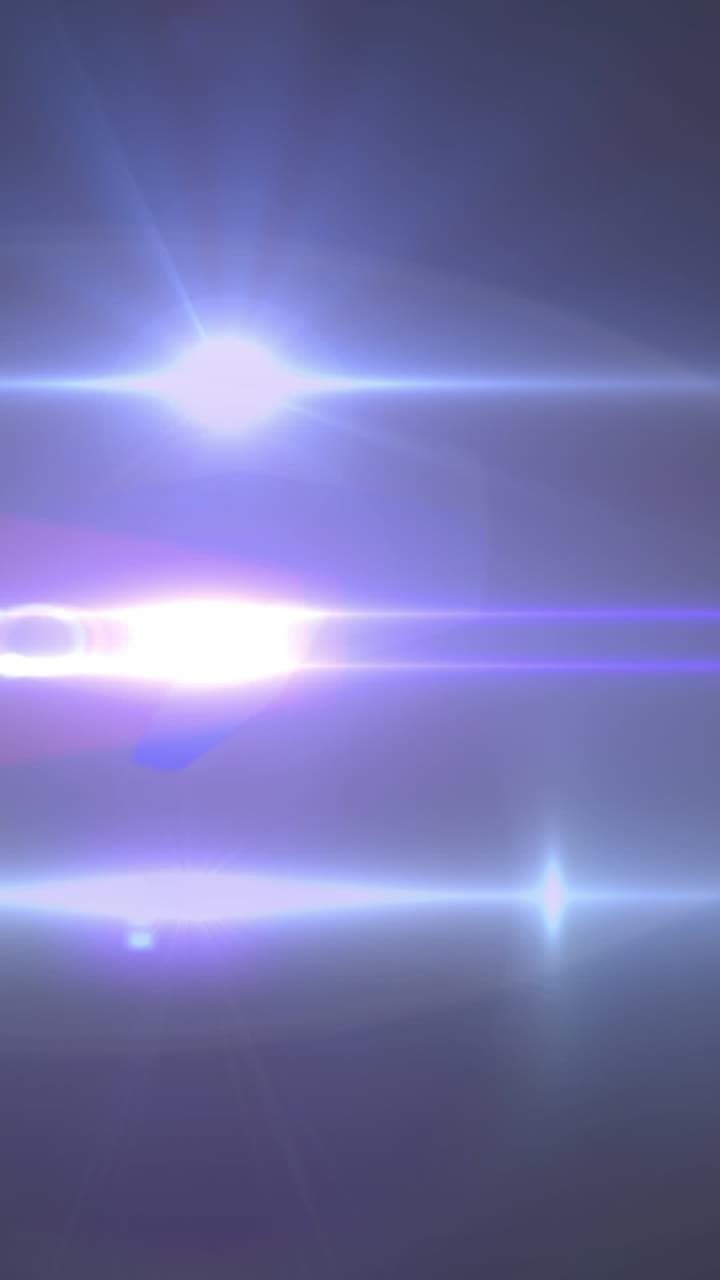 animación de haces de luz que se mueven sobre un fondo oscuro