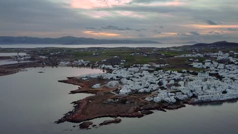 wide drone shot of naoussa, paros, greece during sunrise