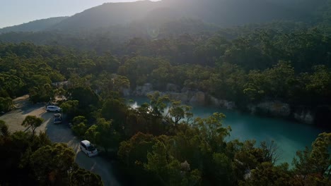 Drone-shot-of-a-breathtaking-view-of-a-little-blue-lake-in-Tasmania,-Australia-during-daytime