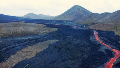 smoking lava field - volcanic landscape in iceland - aerial drone shot