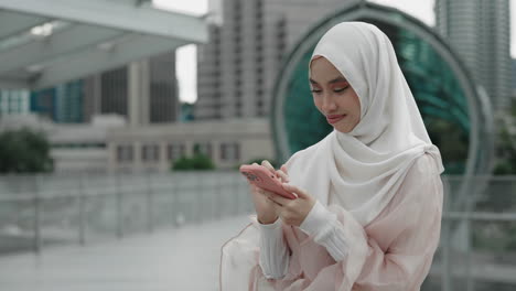 woman using smartphone in city