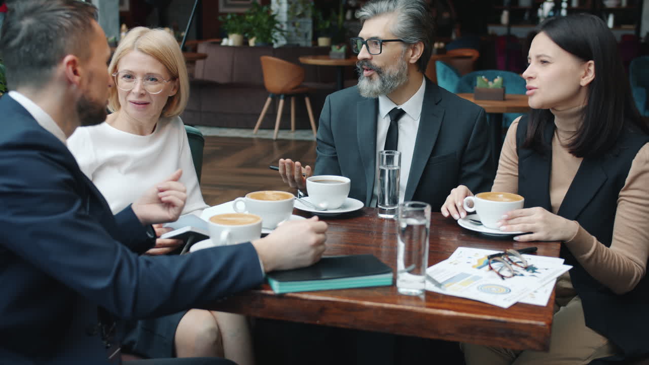 Business Team Meeting in Coffee Shop