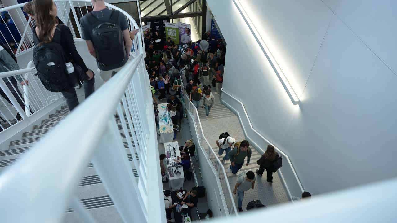 Static shot captures students walking to class at UM Asper School during fall