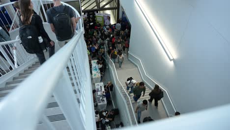 static shot captures students walking to class at um asper school during fall