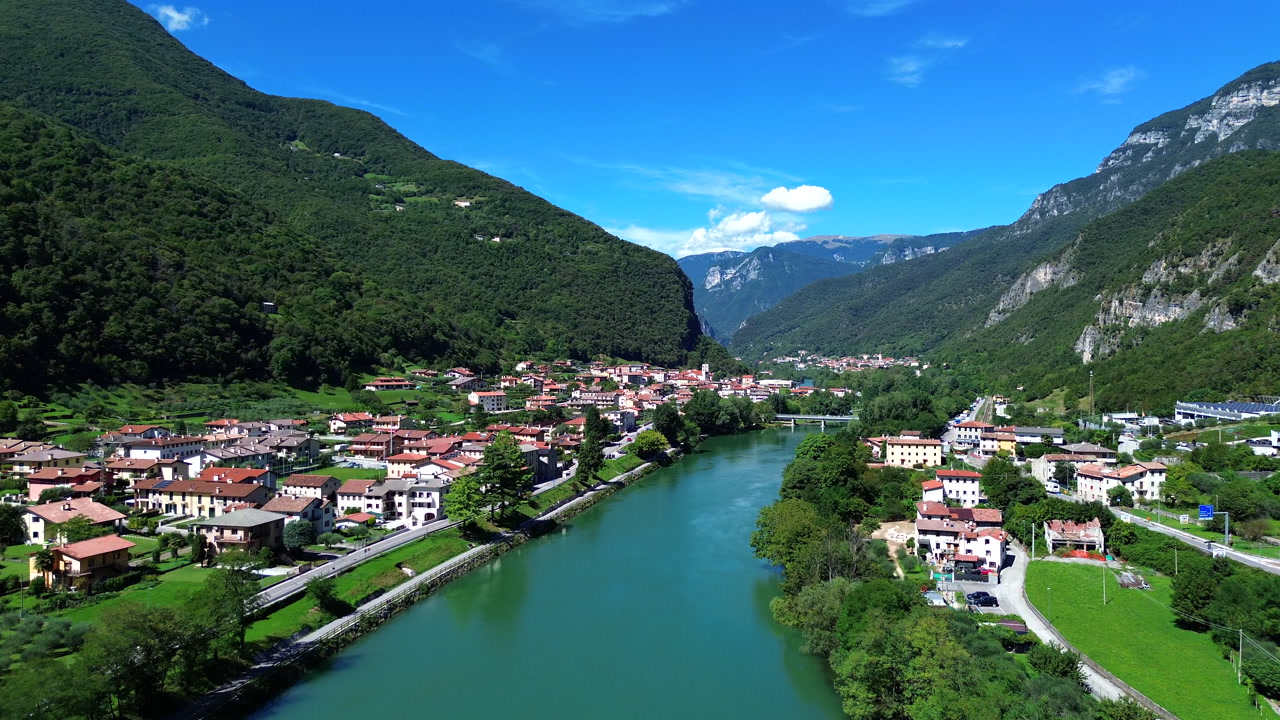 Journey to the heart of Valsugana, where Borgo Valsugana thrives alongside the Brenta River, framed by an unforgettable panorama of breathtaking mountains.