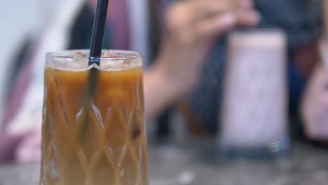 iced coffee with a straw in a glass