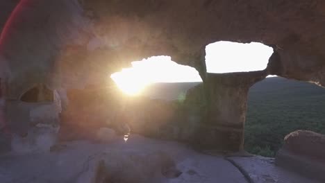 ancient cave at sunset