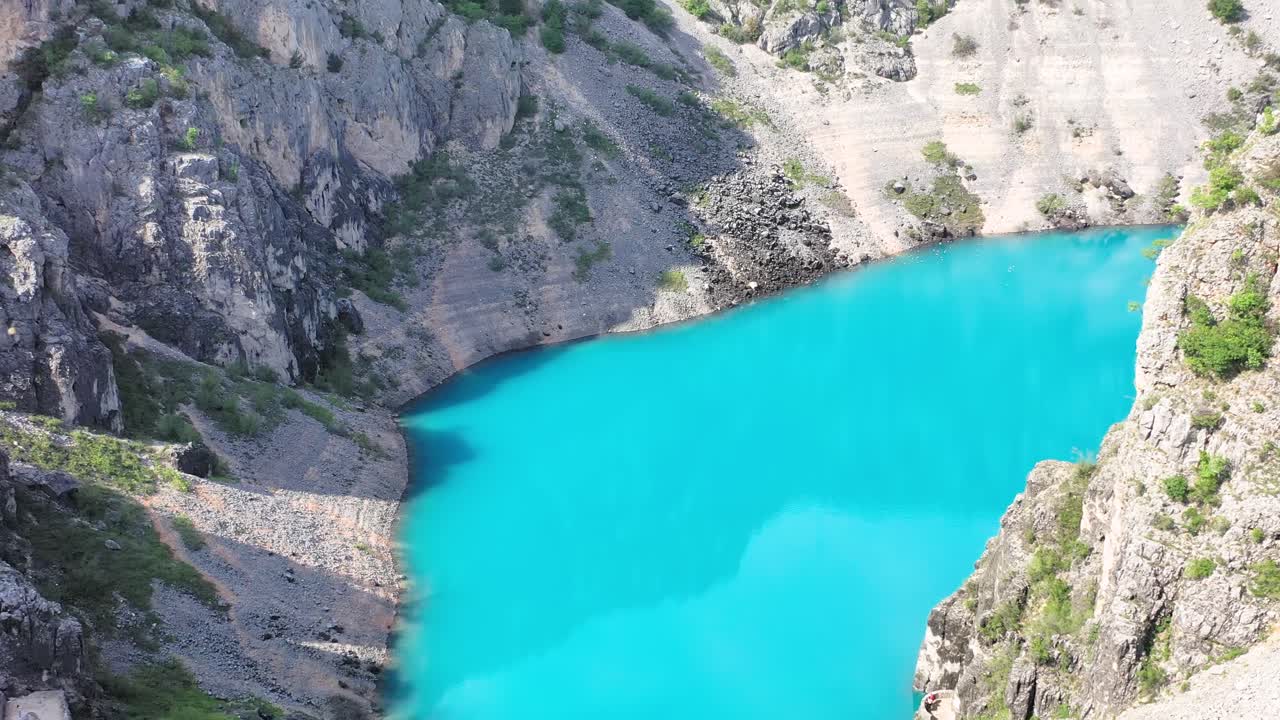 People walking the scenic winding road from Imotski to Blue lake