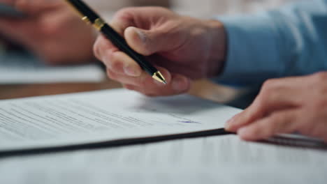 closeup ceo hands signing contract office. unknown man writing pen signature