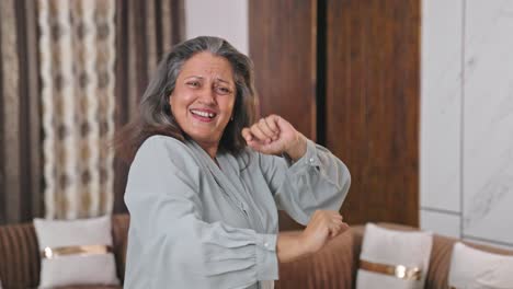 happy indian mother dancing and enjoying