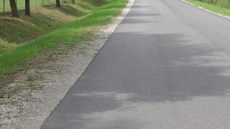 Empty-Paved-Road-During-Sunny-Day-In-Countryside