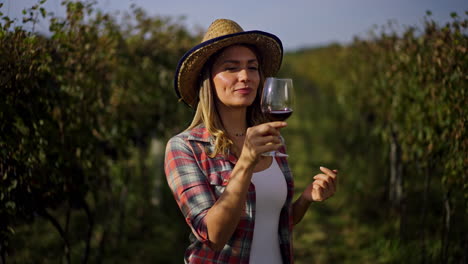 Woman in Vineyard with Wine