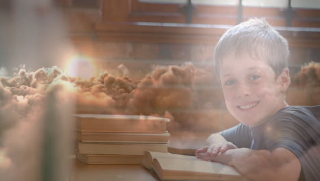 animation of clauds over caucasian boy reading book
