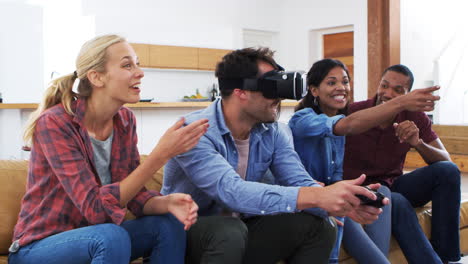 friends playing computer game with virtual reality headset