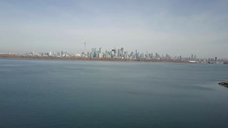 Long-shot-of-city-scape-near-shores-of-vast-blue-sea