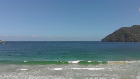 Ascending-drone-footage-of-waves-crashing-at-the-shoreline-the-revealing-a-north-coast-bay