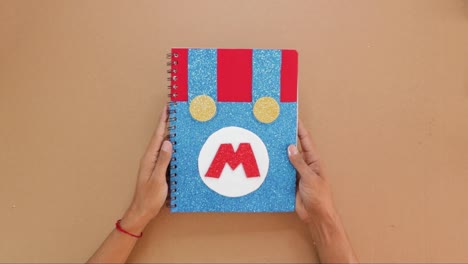 front page of childrens notebook, handmade colorful notebook with video game theme