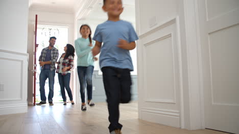 slow motion shot of hispanic family moving into new home