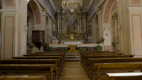 An-inside-tilting-up-of-view-of-an-empty-Catholic-Church,-Having-beautiful-and-antique-art-work