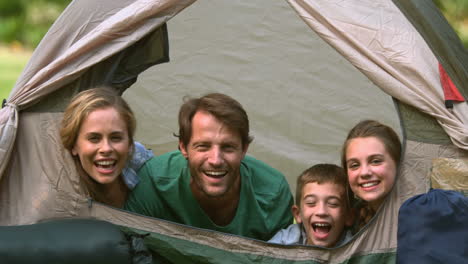 happy family having fun together in a tent