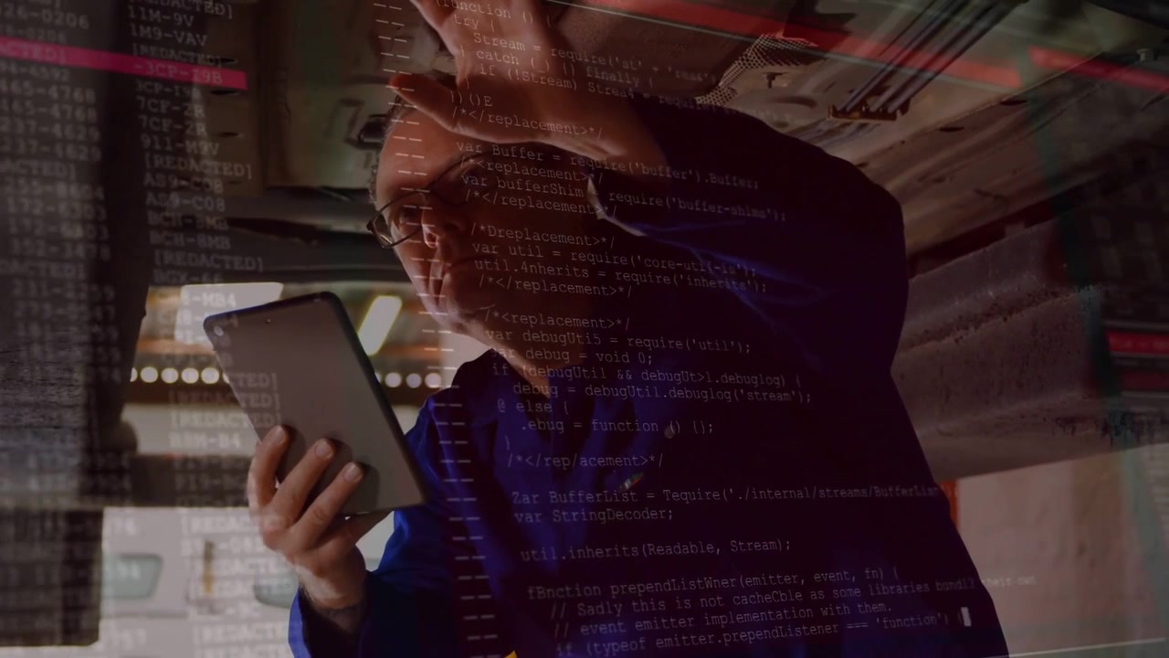 Auto tech tilting and tapping tablet, activating code overlay over underside confirming fault codes