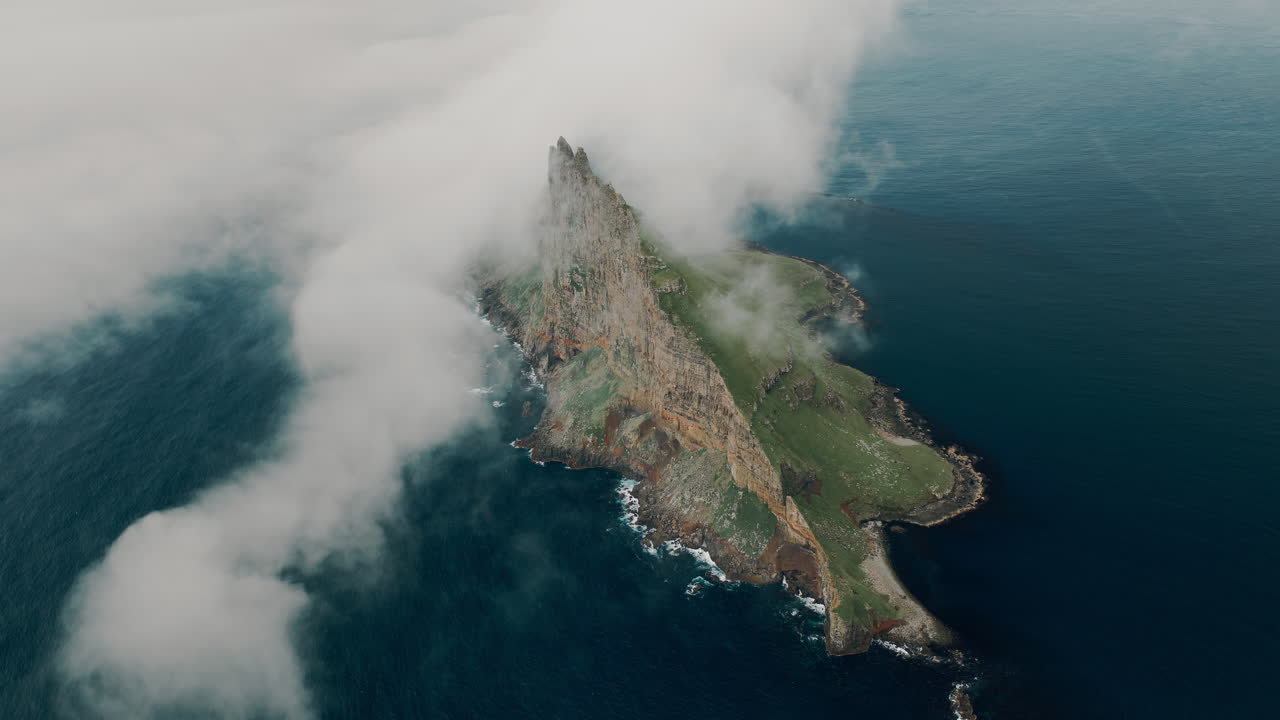 Dramatic Island Landscape Shrouded in Clouds