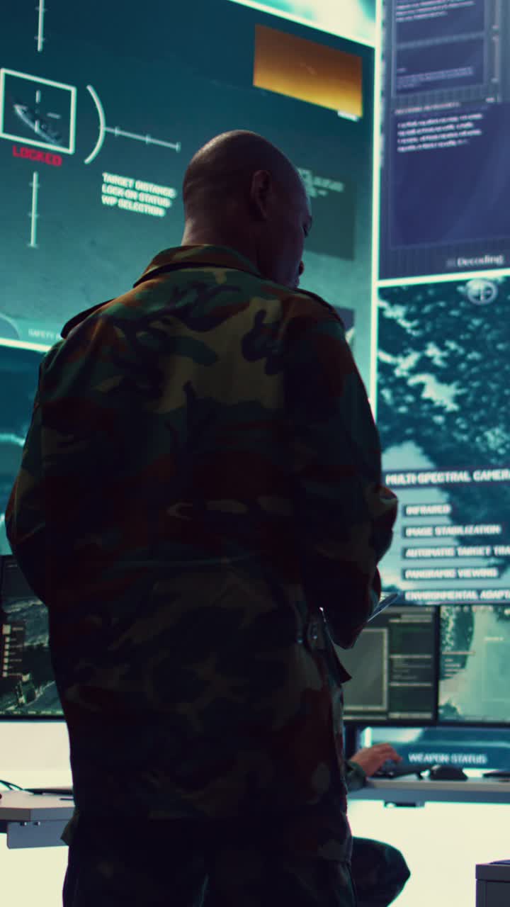 Military Officer in Camouflage Uniform Monitoring Data in Control Room