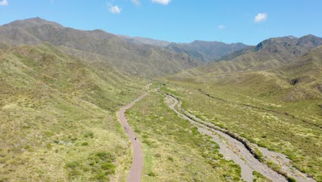 Single-vehicle-traveling-through-Villavicencio-natural-reserve.-Aerial