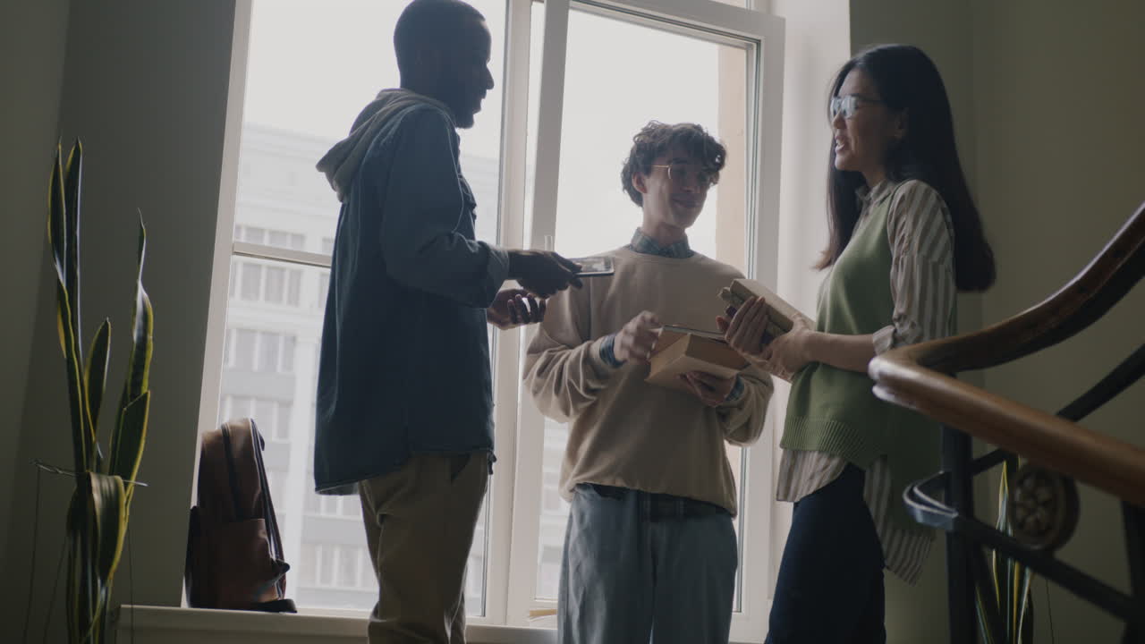 Students Talking and Sharing Food