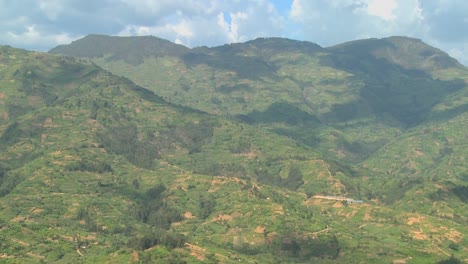 Time-Lapse-shot-of-clouds-and-shadows-moving-over-the-rich-terraced-farmland-of-Rwanda