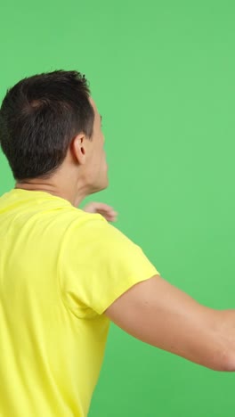 rear view of a man waving a colombian pennant