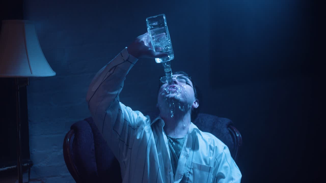 Man dumps alcohol on himself.