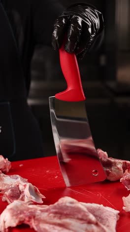chef butchering raw ribs
