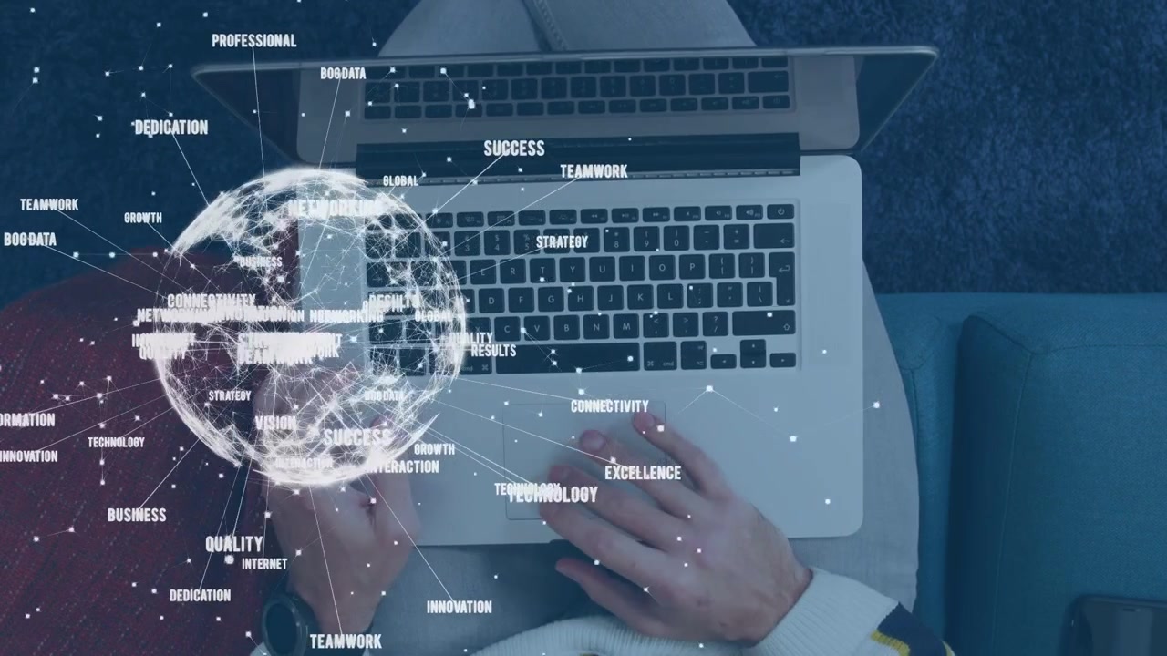 Male hands holding phone over pad, globe appearing growing while typing, showing shift to tech work