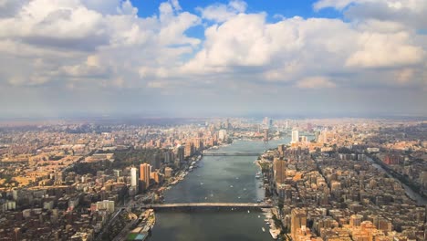 aerial of the nile river meanders through cairo city, with a drone gliding past the beauty of cairo, egypt, embodying the concept of urban vitality and architectural marvels