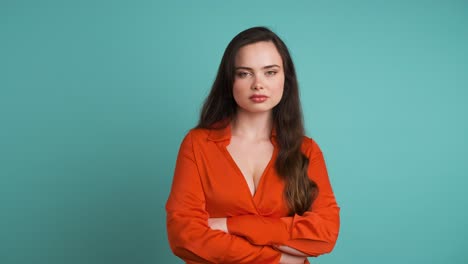 displeased woman shaking head on blue background