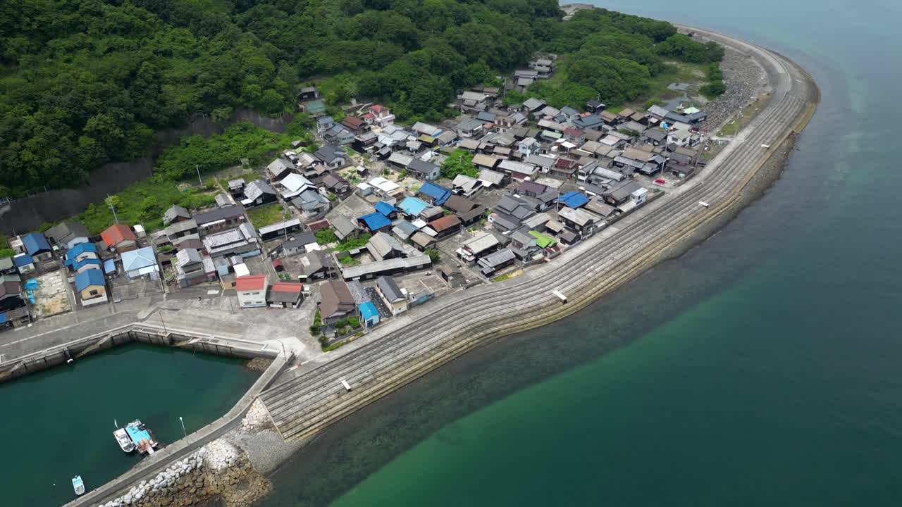 Drone shot over port town on small rural Japanese island