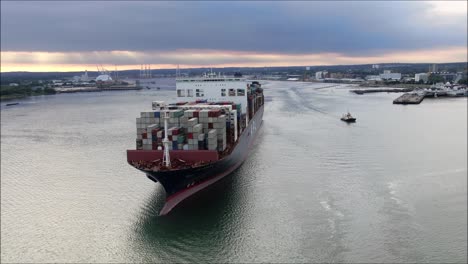 container ship reveal shot as it leaves port