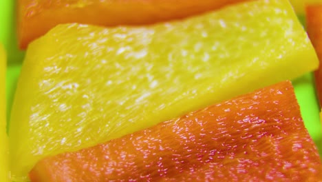 yellow, red, orange bell pepper slices rotating.