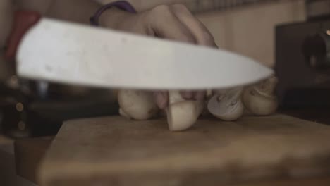 cutting champignon mushrooms with the ceramic knife